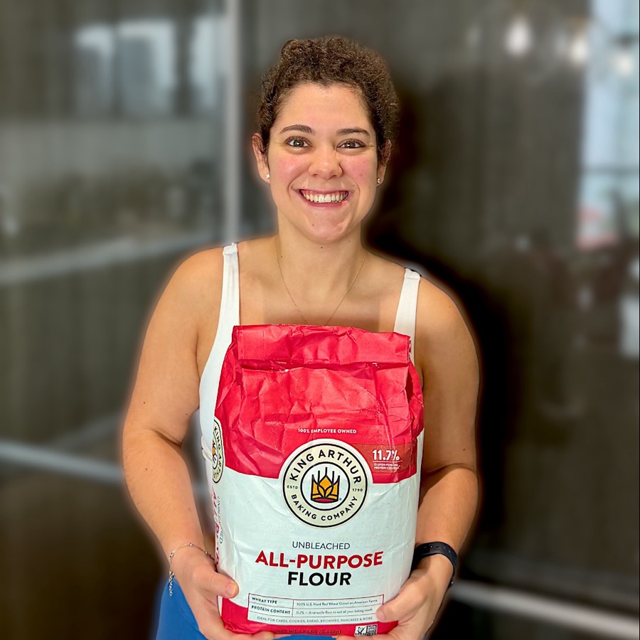 Gaby holding a bag of flour